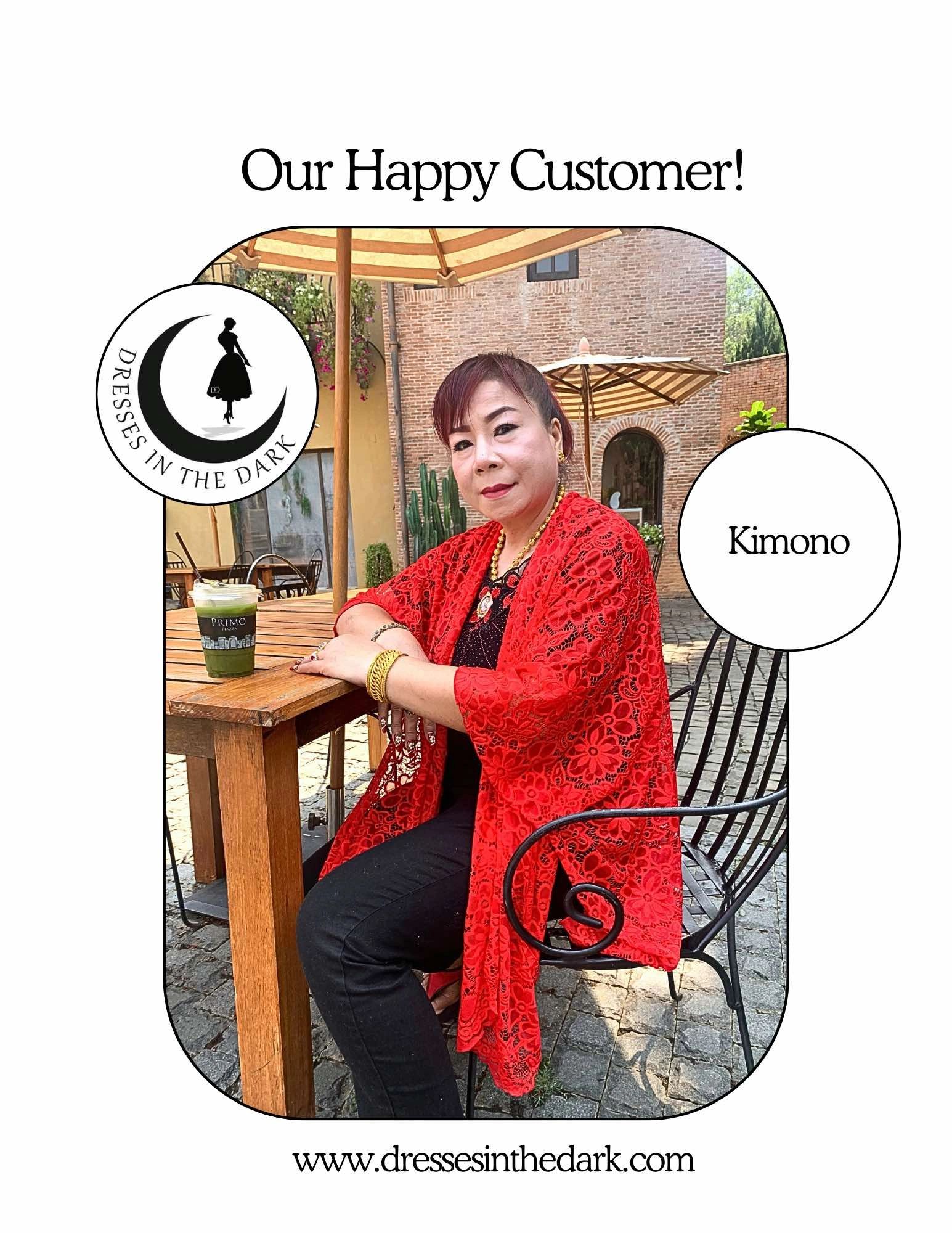 Happy customer wearing red kimono at café